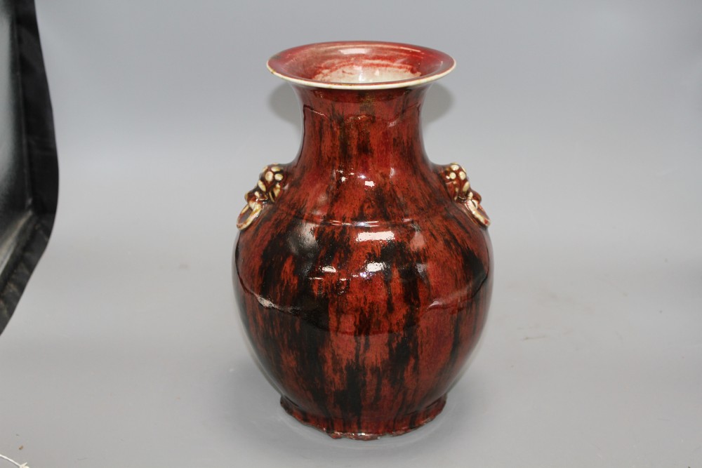 A Chinese flambe vase, with lion mask ring handles to the shoulder, H. 28.5cm